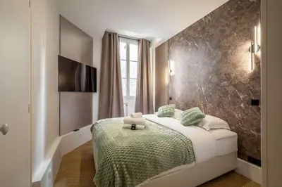 Un ou plusieurs lits dans un hébergement de l'établissement Appartement dauphine muette trocadero - Paris 16 - 4P