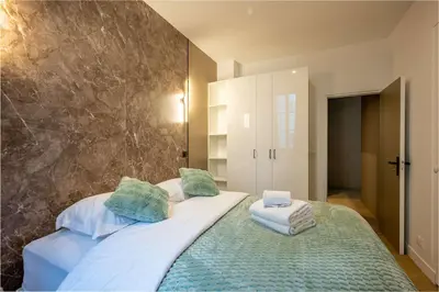 Un ou plusieurs lits dans un hébergement de l'établissement Appartement dauphine muette trocadero - Paris 16 - 4P