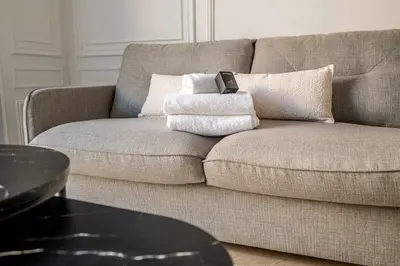 Coin salon dans l'établissement Appartement dauphine muette trocadero - Paris 16 - 4P