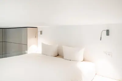 Un ou plusieurs lits dans un hébergement de l'établissement Elegant Luxury Studio Paris 1st