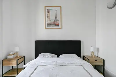 Un ou plusieurs lits dans un hébergement de l'établissement Veridian Apartment Métro Le Kremelin-Bicètre