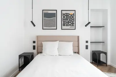 Un ou plusieurs lits dans un hébergement de l'établissement Appartement Design Parisien - Palais Maillot