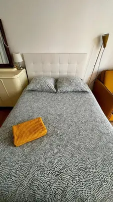 Un ou plusieurs lits dans un hébergement de l'établissement Nid charmant et confortable