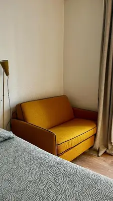 Coin salon dans l'établissement Nid charmant et confortable