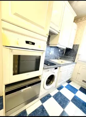 Cuisine ou kitchenette dans l'établissement Appartement Tour Eiffel Chapu