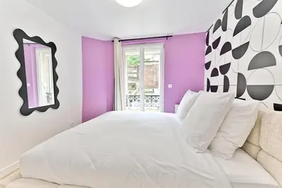 Un ou plusieurs lits dans un hébergement de l'établissement Maisonette 5 minutes from Paris Levallois III