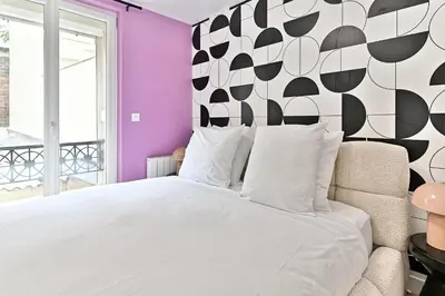 Un ou plusieurs lits dans un hébergement de l'établissement Maisonette 5 minutes from Paris Levallois III