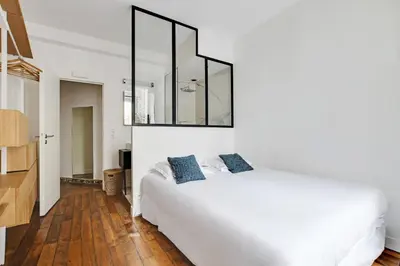 Un ou plusieurs lits dans un hébergement de l'établissement Duplex Loft Montmartre -18th