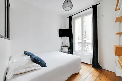 Un ou plusieurs lits dans un hébergement de l'établissement Duplex Loft Montmartre -18th