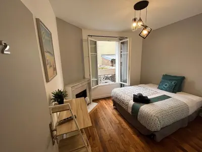 Un ou plusieurs lits dans un hébergement de l'établissement MX - House 10 min PARIS EXPOS- 11 bedrooms -