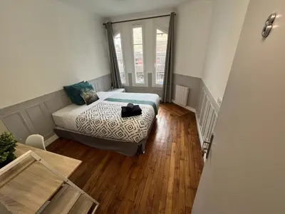 Un ou plusieurs lits dans un hébergement de l'établissement MX - House 10 min PARIS EXPOS- 11 bedrooms -