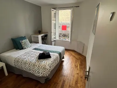 Un ou plusieurs lits dans un hébergement de l'établissement MX - House 10 min PARIS EXPOS- 11 bedrooms -