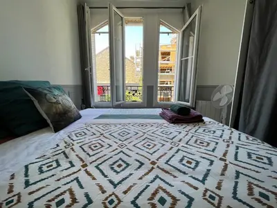 Un ou plusieurs lits dans un hébergement de l'établissement MX - House 10 min PARIS EXPOS- 11 bedrooms -