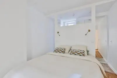 Un ou plusieurs lits dans un hébergement de l'établissement Charmant Appartement Sacrée Coeur Montmartre