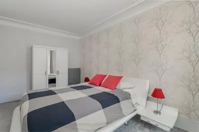 Un ou plusieurs lits dans un hébergement de l'établissement Luxury 5-Bed Residence - Opposite the Eiffel Tower - Located on Avenue Kléber