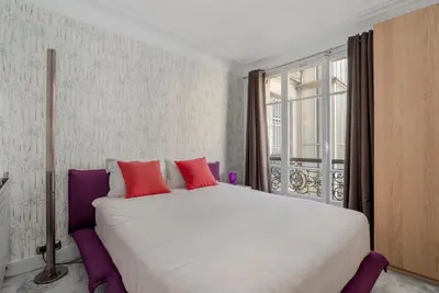 Un ou plusieurs lits dans un hébergement de l'établissement Luxury 5-Bed Residence - Opposite the Eiffel Tower - Located on Avenue Kléber