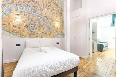 Un ou plusieurs lits dans un hébergement de l'établissement MyKeypers - Stylish & Luxury LOFT 6P - Arc de Triomphe