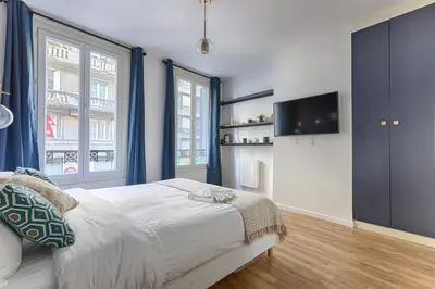 Un ou plusieurs lits dans un hébergement de l'établissement MyKeypers - Amazing Luxury Triplex 3BR 8P - Arc de Triomphe