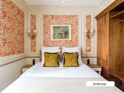 Un ou plusieurs lits dans un hébergement de l'établissement Merveil - Signature Suite - Champs Elysees - Alfred