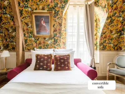 Un ou plusieurs lits dans un hébergement de l'établissement Merveil - Signature Suite - Champs Elysees - Alfred