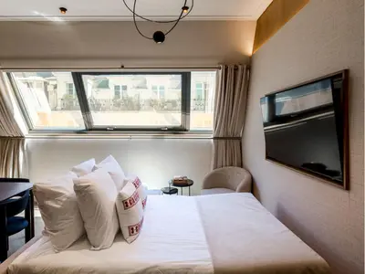 Télévision ou salle de divertissement dans l'établissement Merveil - Signature Suite - Tour Eiffel - Desaix I