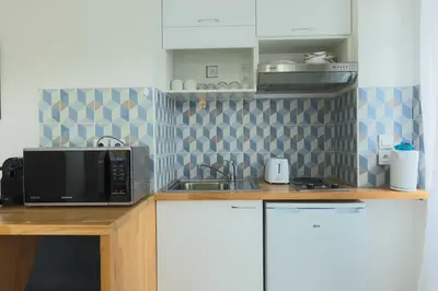 Cuisine ou kitchenette dans l'établissement Studio 2P Roland Garros Parc des