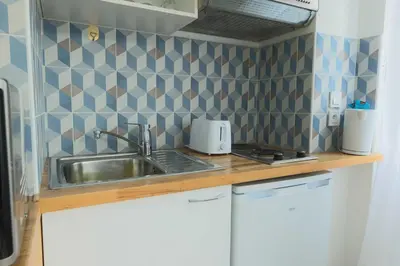 Cuisine ou kitchenette dans l'établissement Studio 2P Roland Garros Parc des