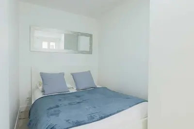 Un ou plusieurs lits dans un hébergement de l'établissement Flat 1BDR 2P Roland Garros Parc des