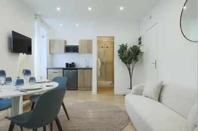 Télévision ou salle de divertissement dans l'établissement Flat 1BDR 2P Roland Garros Parc des