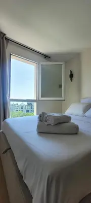 Un ou plusieurs lits dans un hébergement de l'établissement Charming Studio near Paris - La Défense