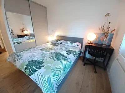 Un ou plusieurs lits dans un hébergement de l'établissement 2 beds, modern building, with mobile AC, Paris Expo, 7' metro 2 steps to Paris