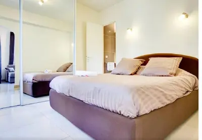Un ou plusieurs lits dans un hébergement de l'établissement Apartment Notre Dame Bright