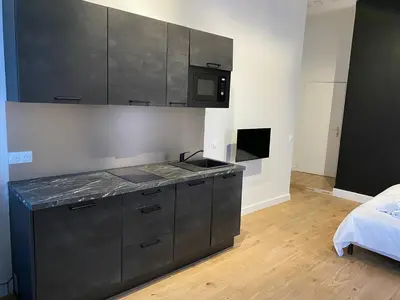 Un ou plusieurs lits dans un hébergement de l'établissement Studio Grand Rex