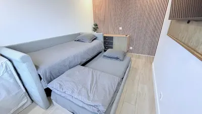 Un ou plusieurs lits dans un hébergement de l'établissement Nice Apartment with amazing view of Paris plus Parking