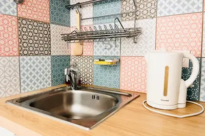 Cuisine ou kitchenette dans l'établissement Appartement élégant entre Opéra et Saint-Lazare