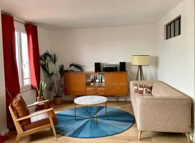 Coin salon dans l'établissement Cosy apartment with a magnificent view 10 min from Paris Exhibition Centre