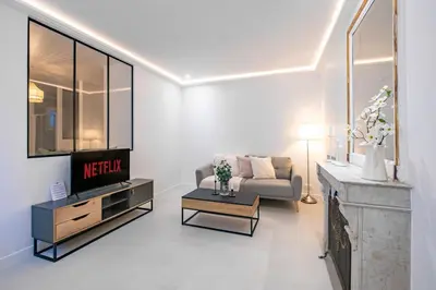 Coin salon dans l'établissement Haussmann Apartment - Champs-Élysées
