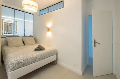 Un ou plusieurs lits dans un hébergement de l'établissement Haussmann Apartment - Champs-Élysées