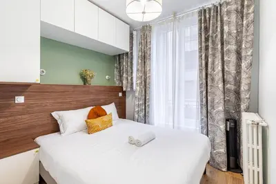 Un ou plusieurs lits dans un hébergement de l'établissement GuestReady - Peaceful escape in Père-Lachaise