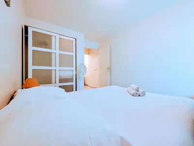 Un ou plusieurs lits dans un hébergement de l'établissement Chic apart with bar in Paris