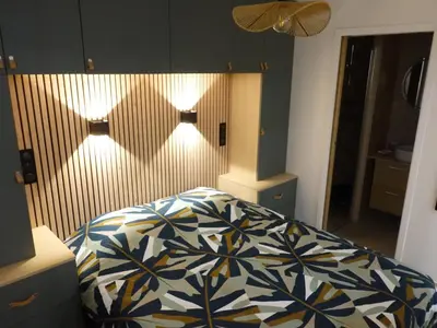 Un ou plusieurs lits dans un hébergement de l'établissement Appartement cosy au cœur du 15e - 1br-3p