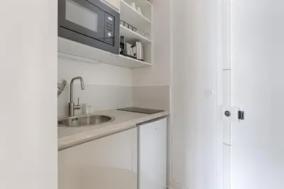 Cuisine ou kitchenette dans l'établissement Mykeypers - Studio Cozy 2P - Malakoff 11