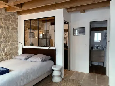 Un ou plusieurs lits dans un hébergement de l'établissement Charming studio