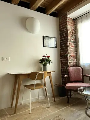 Coin salon dans l'établissement Charming studio