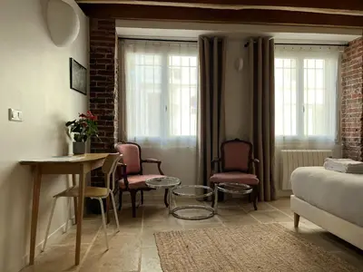 Coin salon dans l'établissement Charming studio