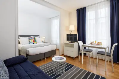 Un ou plusieurs lits dans un hébergement de l'établissement Hotel Résidence Paris Asnières