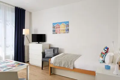 Un ou plusieurs lits dans un hébergement de l'établissement Hotel Résidence Paris Asnières