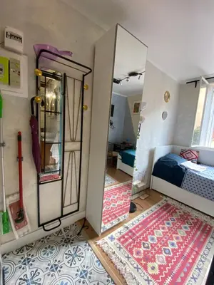 Un ou plusieurs lits dans un hébergement de l'établissement Charming Arty Studio