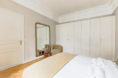 Un ou plusieurs lits dans un hébergement de l'établissement Grand appartement luxe - Trocadéro
