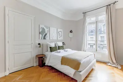 Un ou plusieurs lits dans un hébergement de l'établissement Grand appartement luxe - Trocadéro